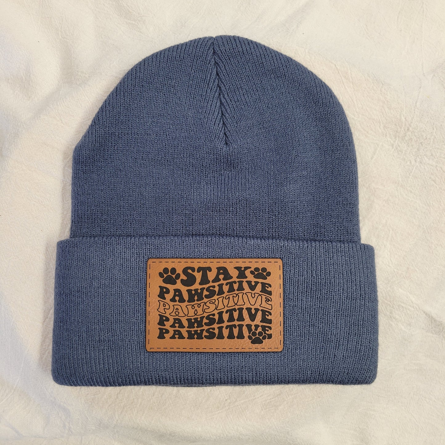 Beanies with pet quote patches