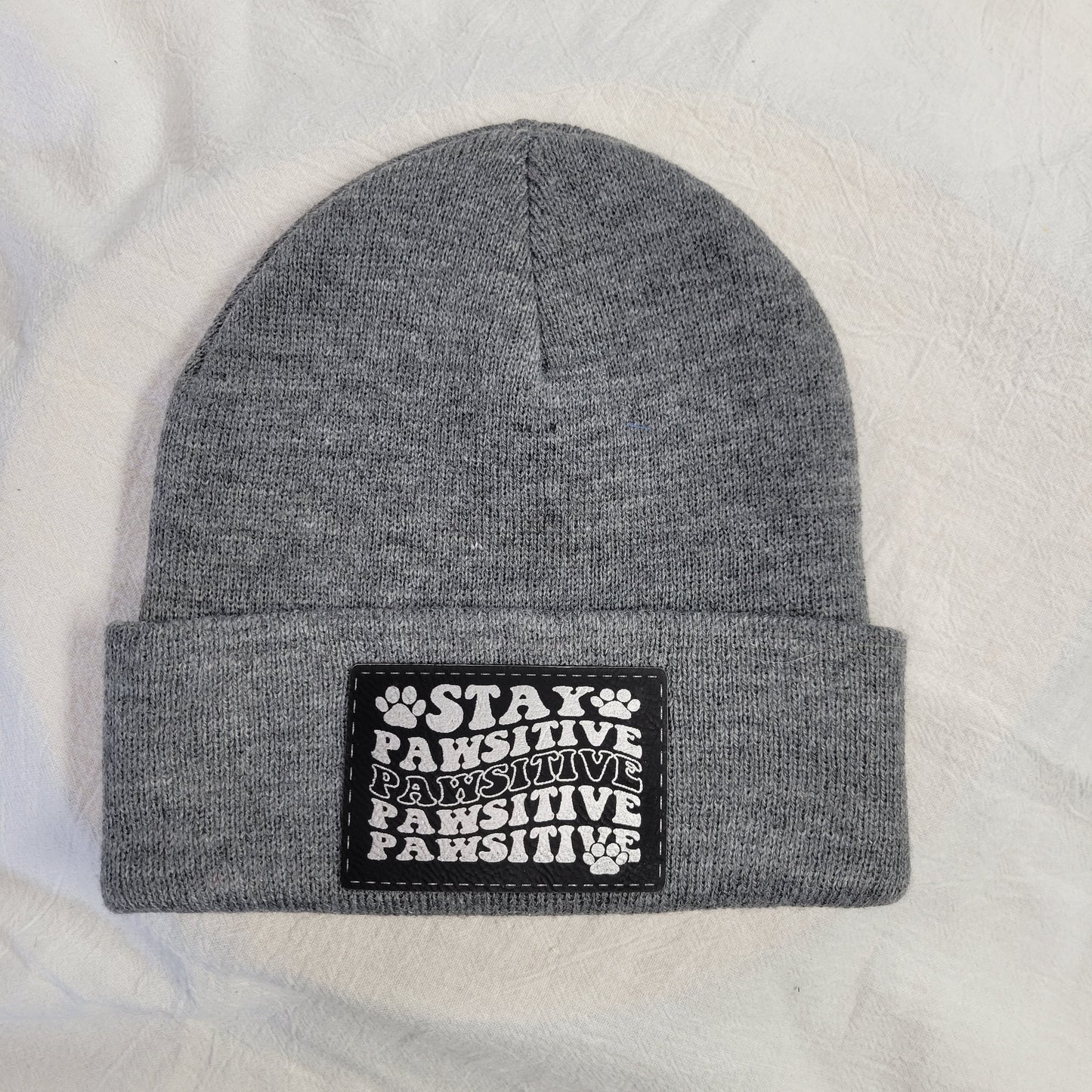 Beanies with pet quote patches